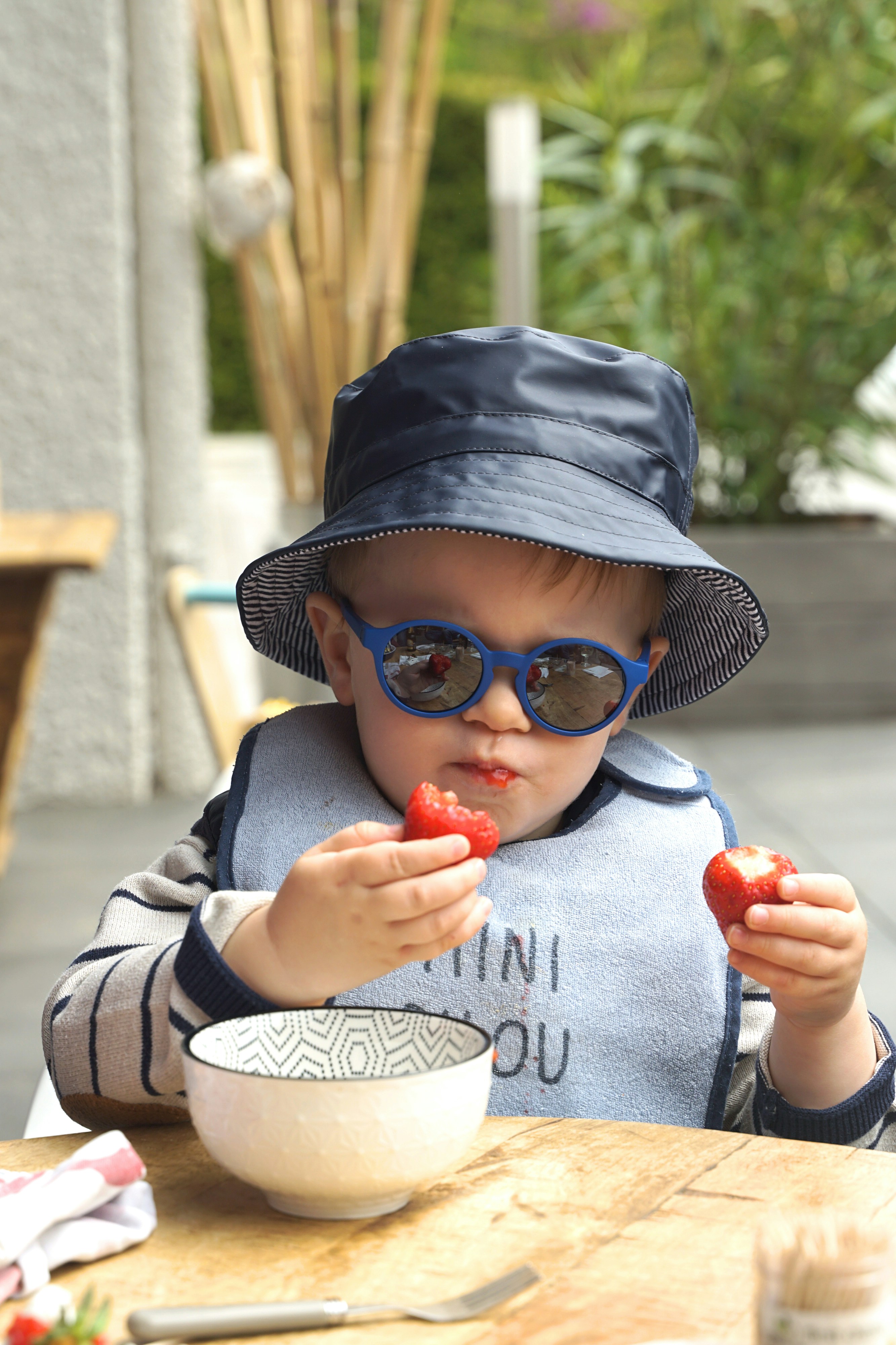 Baby eating strawberries